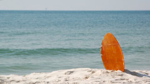 A boogie board sitting on the beach in Maui