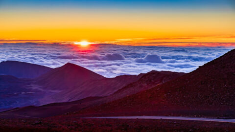 The sunrise above the clouds on the summit of Haleakala